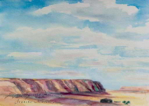 Navajo Land Unframed Original Southwest Watercolor Painting a view of a large sky with hill of rock and a small Navajo home 